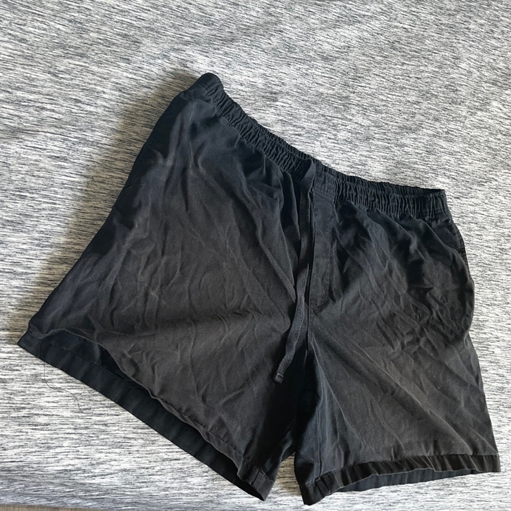 Black shorts and a grey shirt